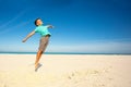 Relaxed and happy boy jump on the sand sea beach Royalty Free Stock Photo