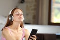 Relaxed homeowner listening to music at home Royalty Free Stock Photo