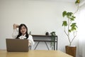 A relaxed Japanese woman by remote work in the small office Royalty Free Stock Photo