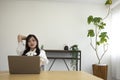 A relaxed Japanese woman by remote work in the small office Royalty Free Stock Photo