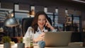 Relaxed lady resting smartphone night city view office. Woman relaxing armchair Royalty Free Stock Photo