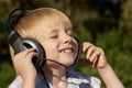 Relaxed little boy listening music Royalty Free Stock Photo