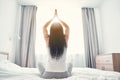 Relaxed longhaired girl doing yoga activity alone