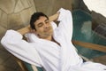 Relaxed Man In Bathrobe Sitting On Chair Royalty Free Stock Photo