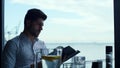 Relaxed man customer reading wine list in panoramic luxury lounge bar portrait Royalty Free Stock Photo