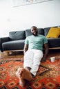 Relaxed man at home on the floor stock photo