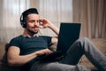 Relaxed Man Listening to Music on His Laptop at Home Royalty Free Stock Photo