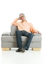 Relaxed man sitting on couch Royalty Free Stock Photo