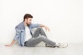 Relaxed man sitting on floor Royalty Free Stock Photo