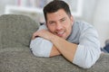 relaxed man sitting on sofa Royalty Free Stock Photo