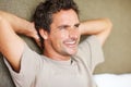 Relaxed man smiling with hands behind head. Closeup of handsome mature man smiling with hands behind head. Royalty Free Stock Photo