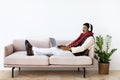 Relaxed mature indian man using laptop and headset Royalty Free Stock Photo