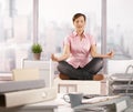 Relaxed office worker doing yoga Royalty Free Stock Photo