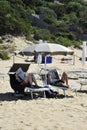 Relaxed people on the Sabaudia beach for the summer holidays. The Circeo Mountain on the background. Sabaudia, Lazio, Italy