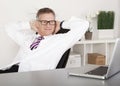 Relaxed Physician Smiling While Watching at Laptop