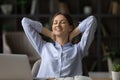 Relaxed pleasant happy young woman enjoying break time. Royalty Free Stock Photo