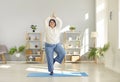 Relaxed plus size woman practicing yoga at home Royalty Free Stock Photo