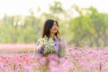 Relaxed serene and carefree pretty asian woman at flower garden in Chiangmai, concept photo of travel and freedom