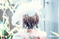 Relaxed young naked woman in bath with foam on her head, luxury villa, tropical Bali island, Indonesia. Royalty Free Stock Photo