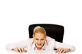 Relaxed smile business woman lying on the desk