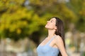 Relaxed teen breathing fresh air in a park