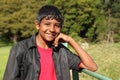 Relaxed teenage boy in bright countryside sunshine