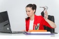 Relaxed and winning business woman sitting with her legs on desk and looking at her shoes Royalty Free Stock Photo