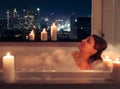 Relaxed woman in bathroom with candles