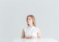 Relaxed woman with closed eyes sitting at the table Royalty Free Stock Photo