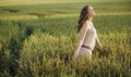 Relaxed woman on the corn field Royalty Free Stock Photo