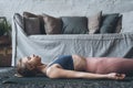 Relaxed woman in Dead Body pose at home Royalty Free Stock Photo