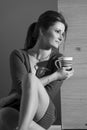 Relaxed woman drinking tea or coffee BW Royalty Free Stock Photo