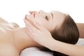 Relaxed woman enjoy receiving face massage at spa saloon Royalty Free Stock Photo