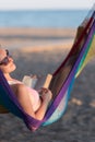 Relaxed woman laying in hammock Royalty Free Stock Photo