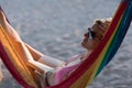 Relaxed woman laying in hammock Royalty Free Stock Photo