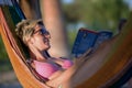 Relaxed woman laying in hammock Royalty Free Stock Photo