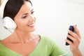 Relaxed woman listening to music on headphones Royalty Free Stock Photo