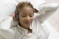 Relaxed Woman Listening To Music On Portable CD Player