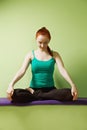 Relaxed woman in lotus pose Royalty Free Stock Photo