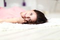 Relaxed woman lying on the floor indoors Royalty Free Stock Photo