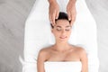 Relaxed woman receiving head massage Royalty Free Stock Photo