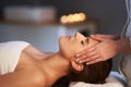 Relaxed woman receiving head massage Royalty Free Stock Photo