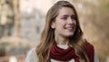 Relaxed woman smiling outdoors. Beautiful hipster girl relaxing on city street. Royalty Free Stock Photo