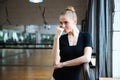 Relaxed woman standing in ballet class Royalty Free Stock Photo