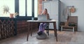 Relaxed work during lockdown. Young smiling blonde business woman in pajama pants works online using laptop video call. Royalty Free Stock Photo