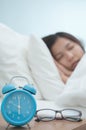 Relaxed of young Asian woman sleeping on bed in winter Royalty Free Stock Photo