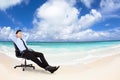 Relaxed Young businessman sitting in chair Royalty Free Stock Photo