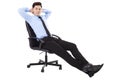 Relaxed Young businessman sitting in a chair isolated Royalty Free Stock Photo
