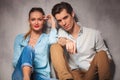 Relaxed young casual couple sitting together Royalty Free Stock Photo