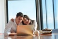 Relaxed young couple working on laptop computer at home Royalty Free Stock Photo